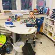Advent Child sits at the teacher's desk