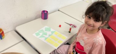 Math A girl tinkers with geometric shapes