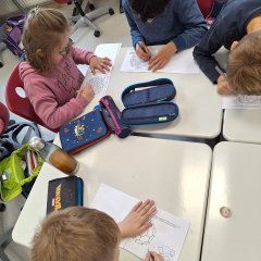 Children work on the soccer booklet